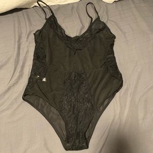 Black lace body suit. Never worn